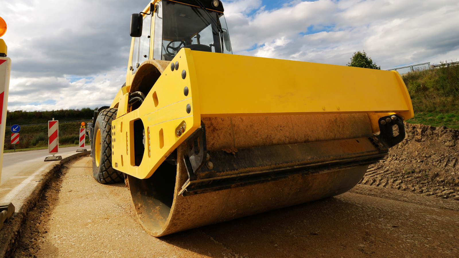 A stock image of road construction machinery. 