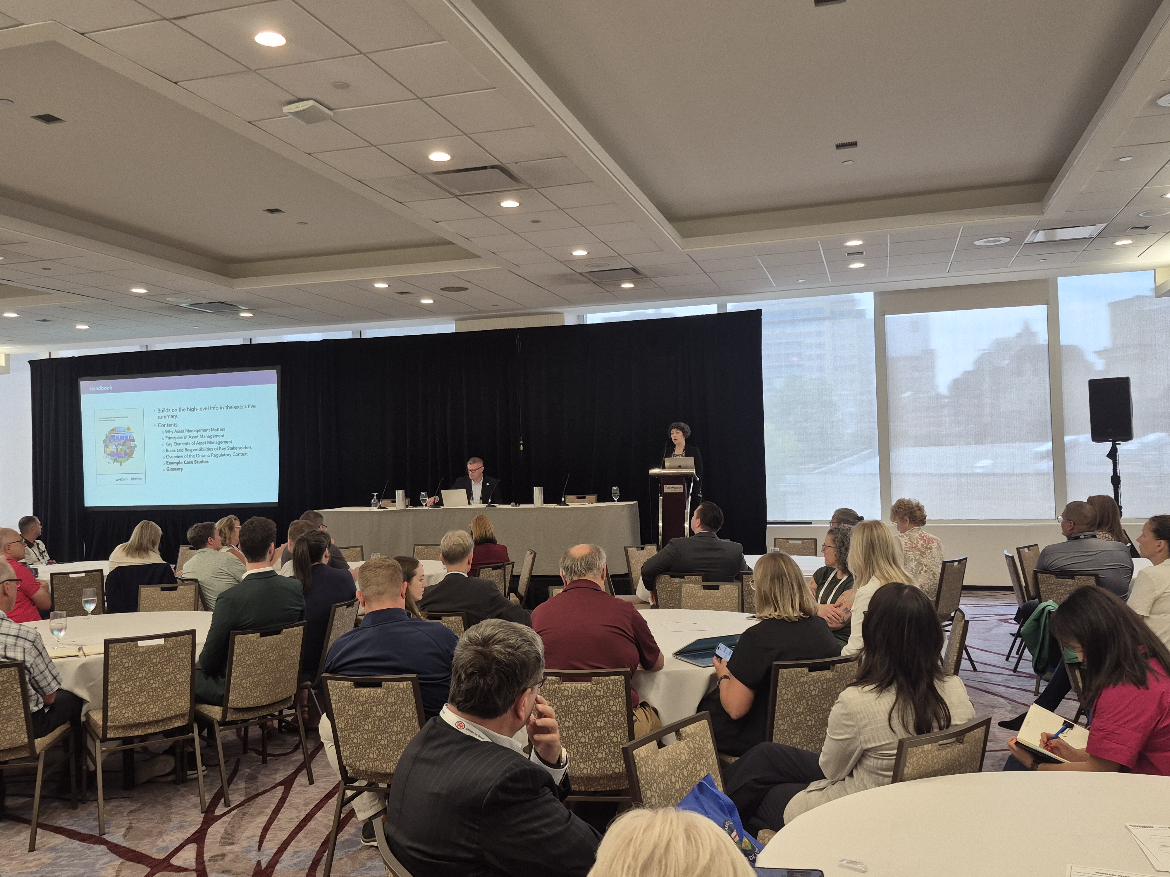 the stage and crowd at a conference session 