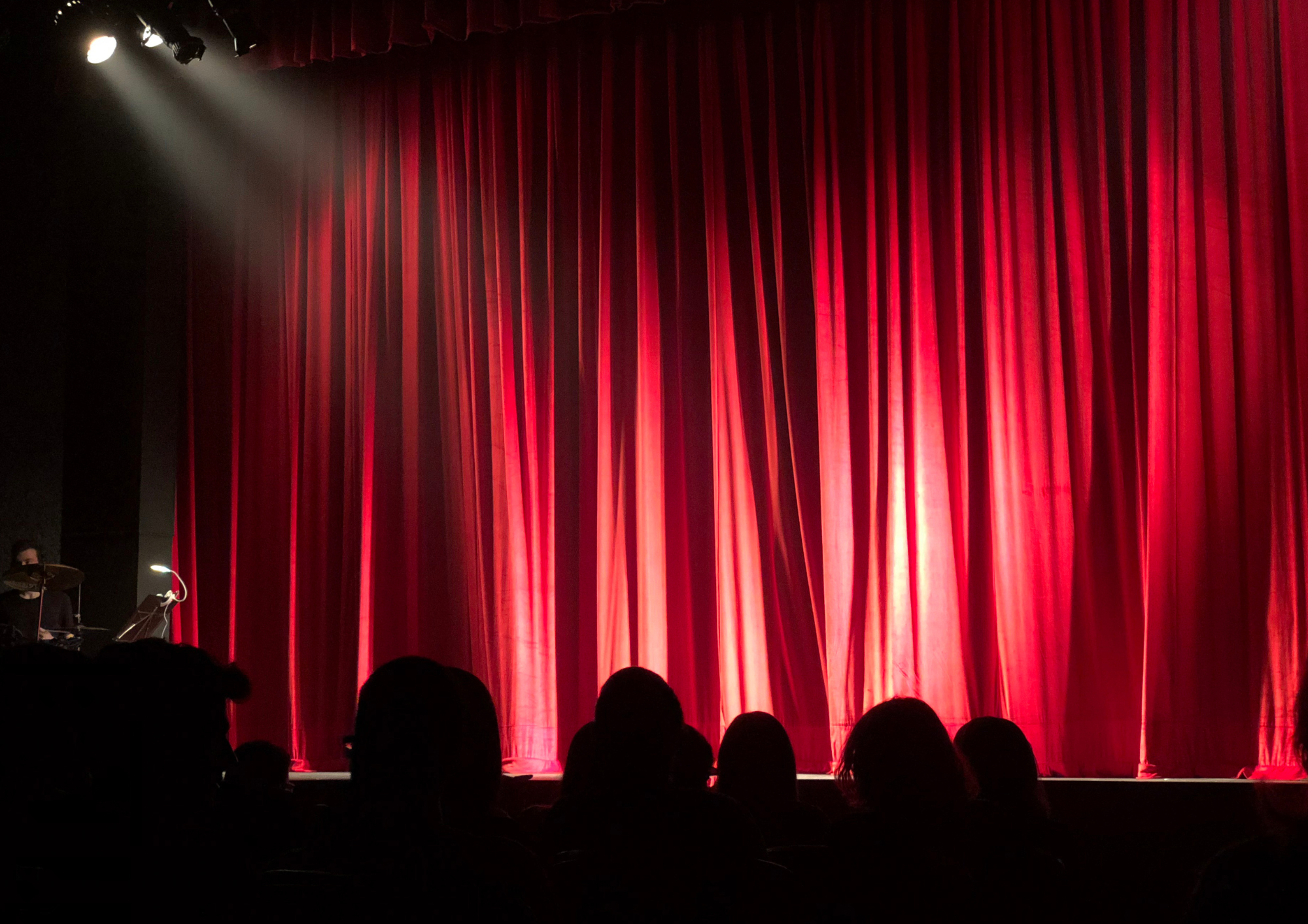 Stock image of a dark performance theatre.