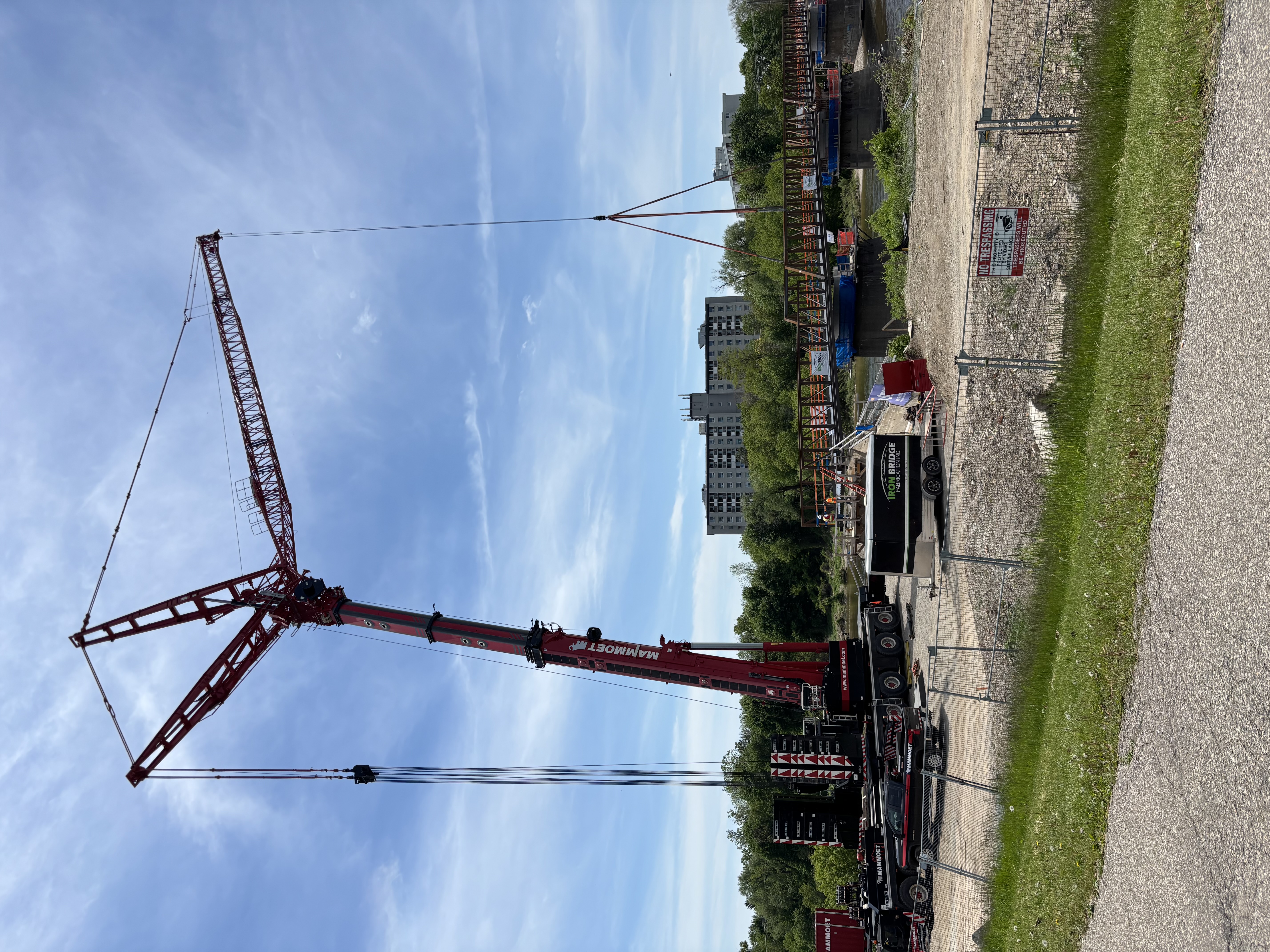 crane lifting piece of bridge into place