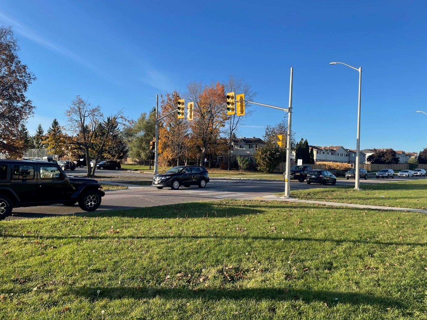 A crosswalk with cars going by