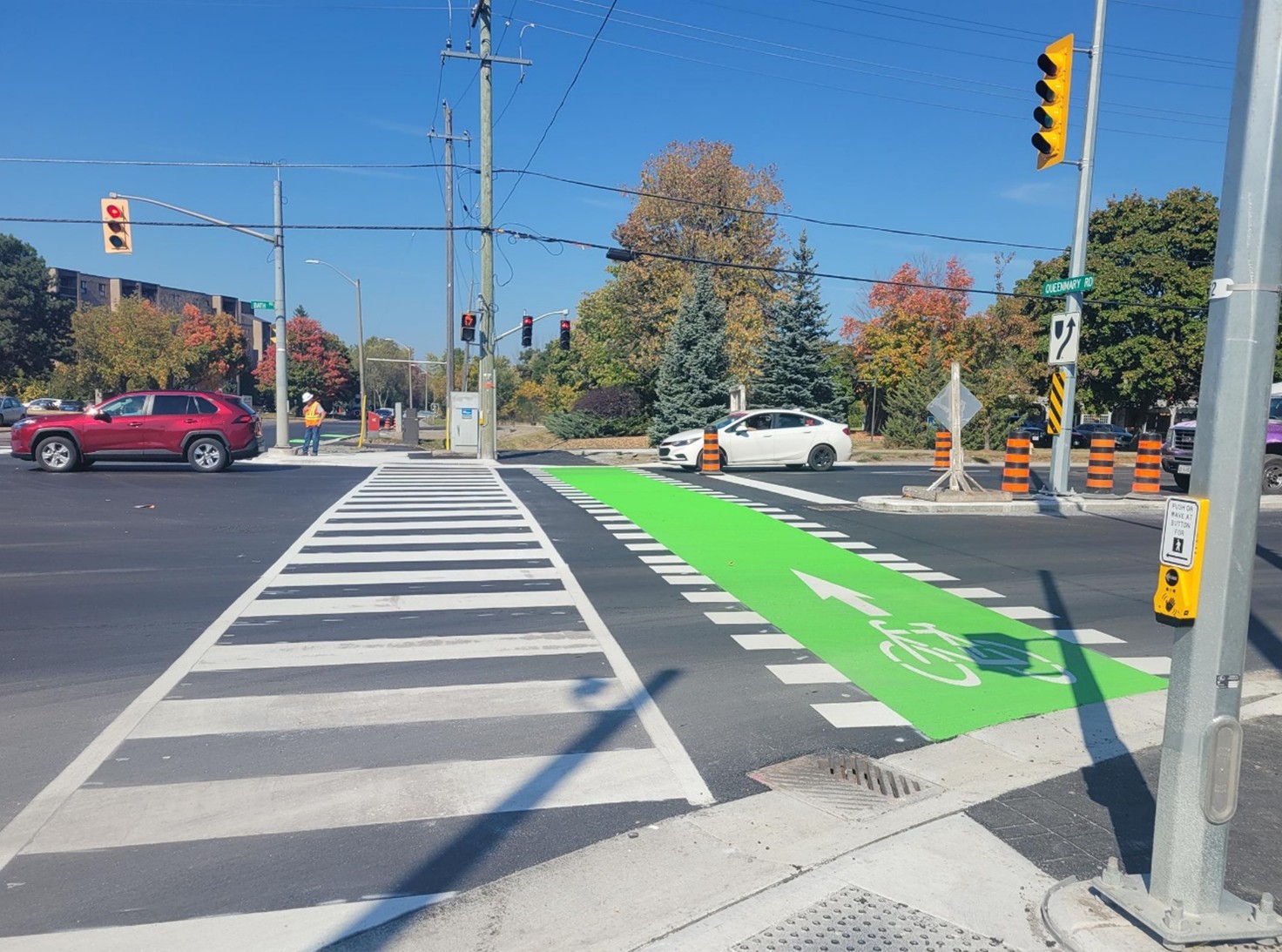 A pedestrian crossing with a bike lane