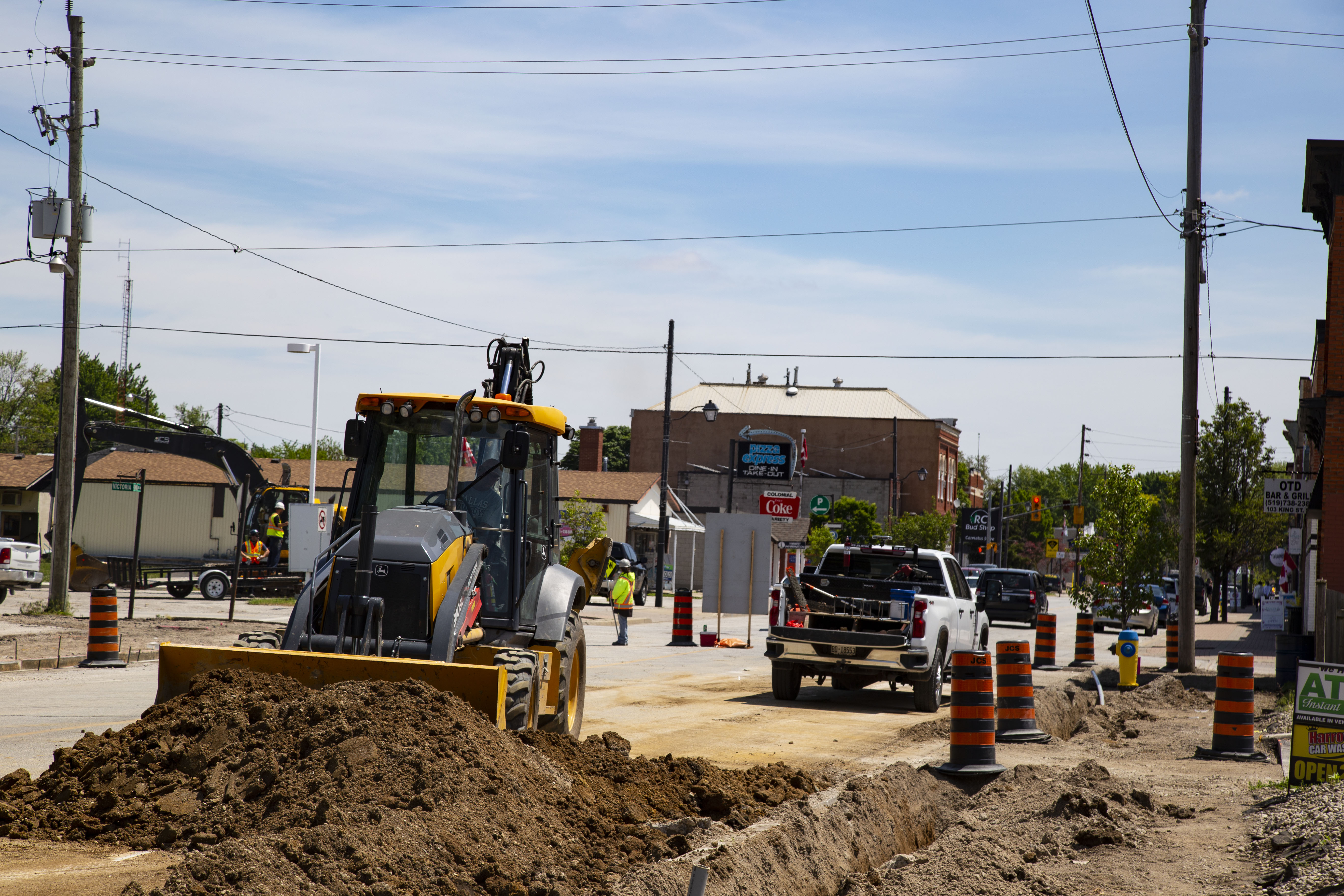 Construction machinery works on Harrow Street in downtown Essex, Ontario.