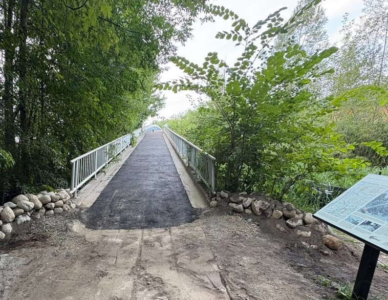 A pedestrian bridge over a highway