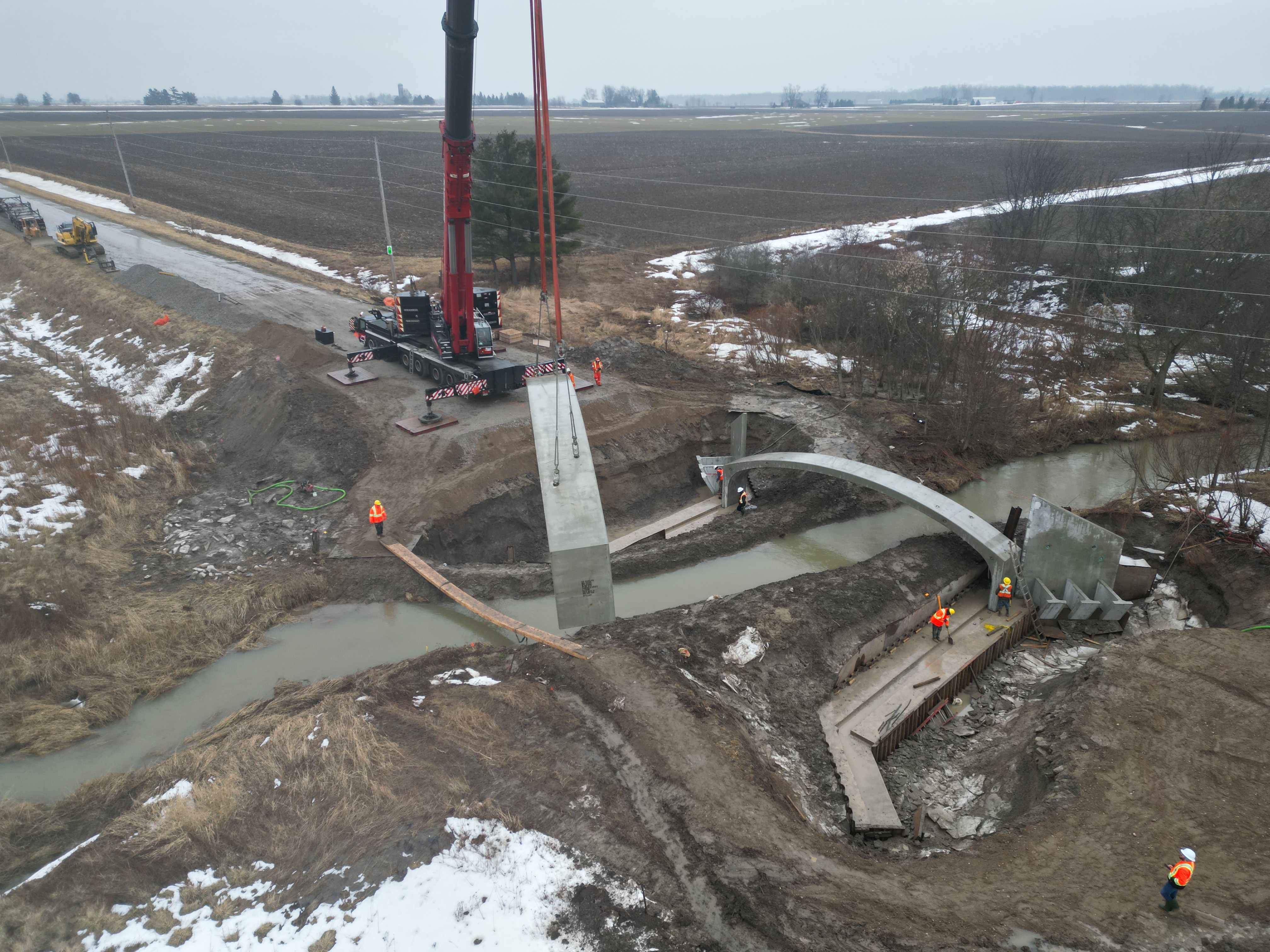 Crane lifting bridge into place