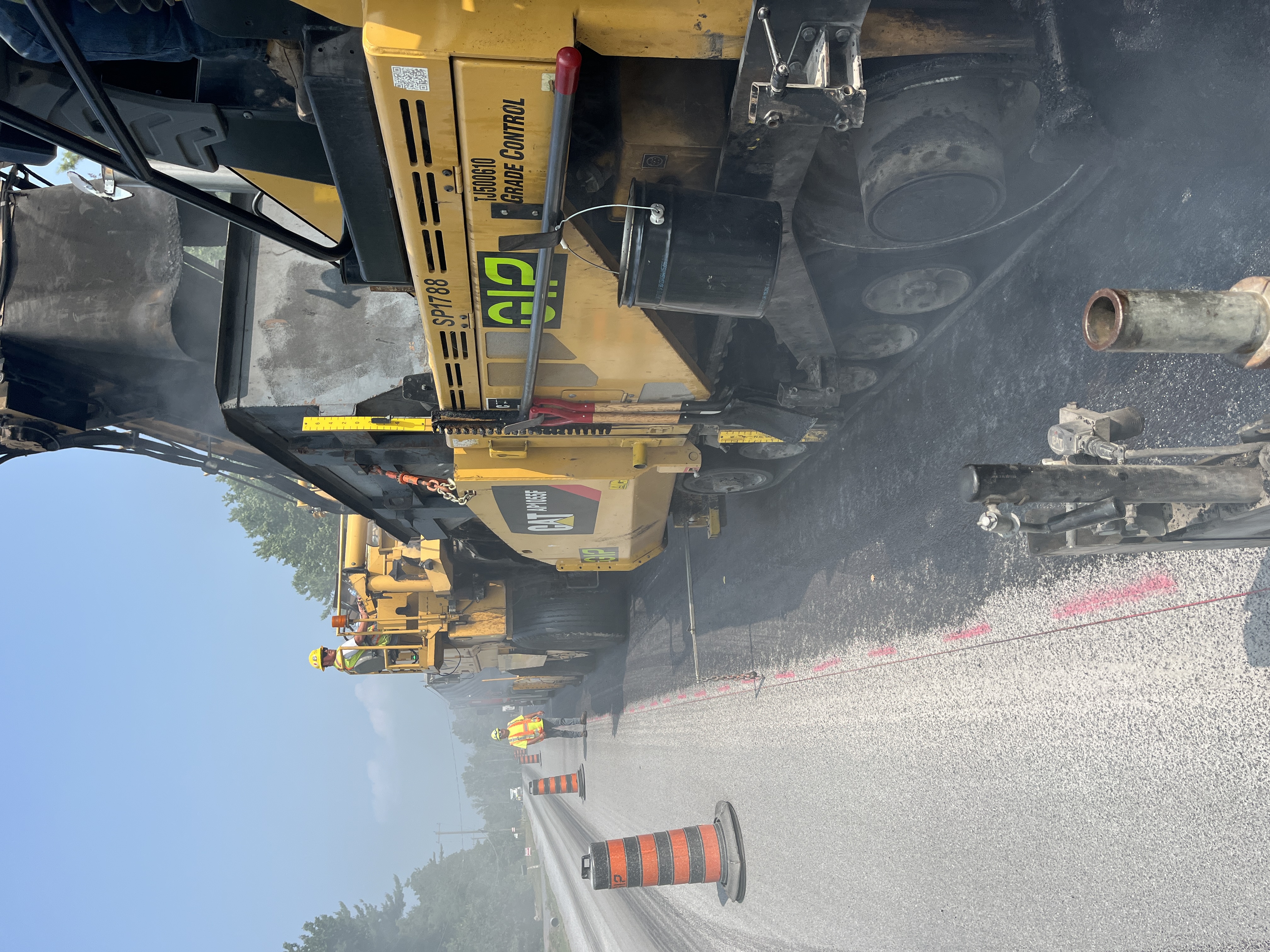 A construction crew paving a road