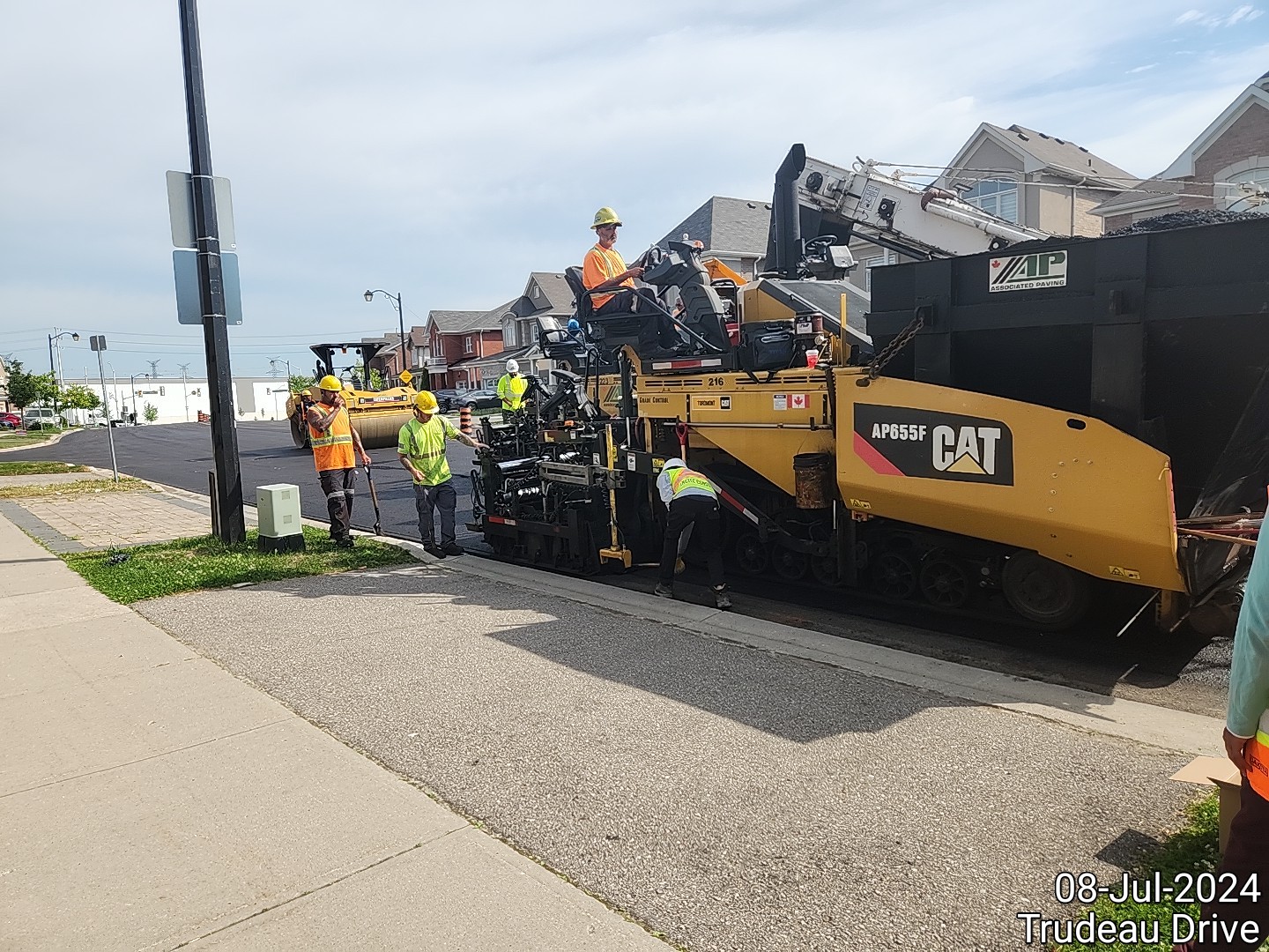 Construction workers working on a residential street