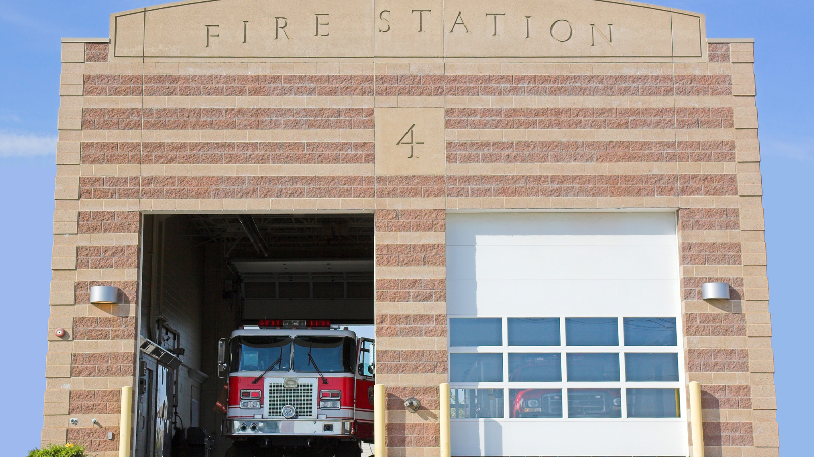 A photo of the outside of a fire station. 