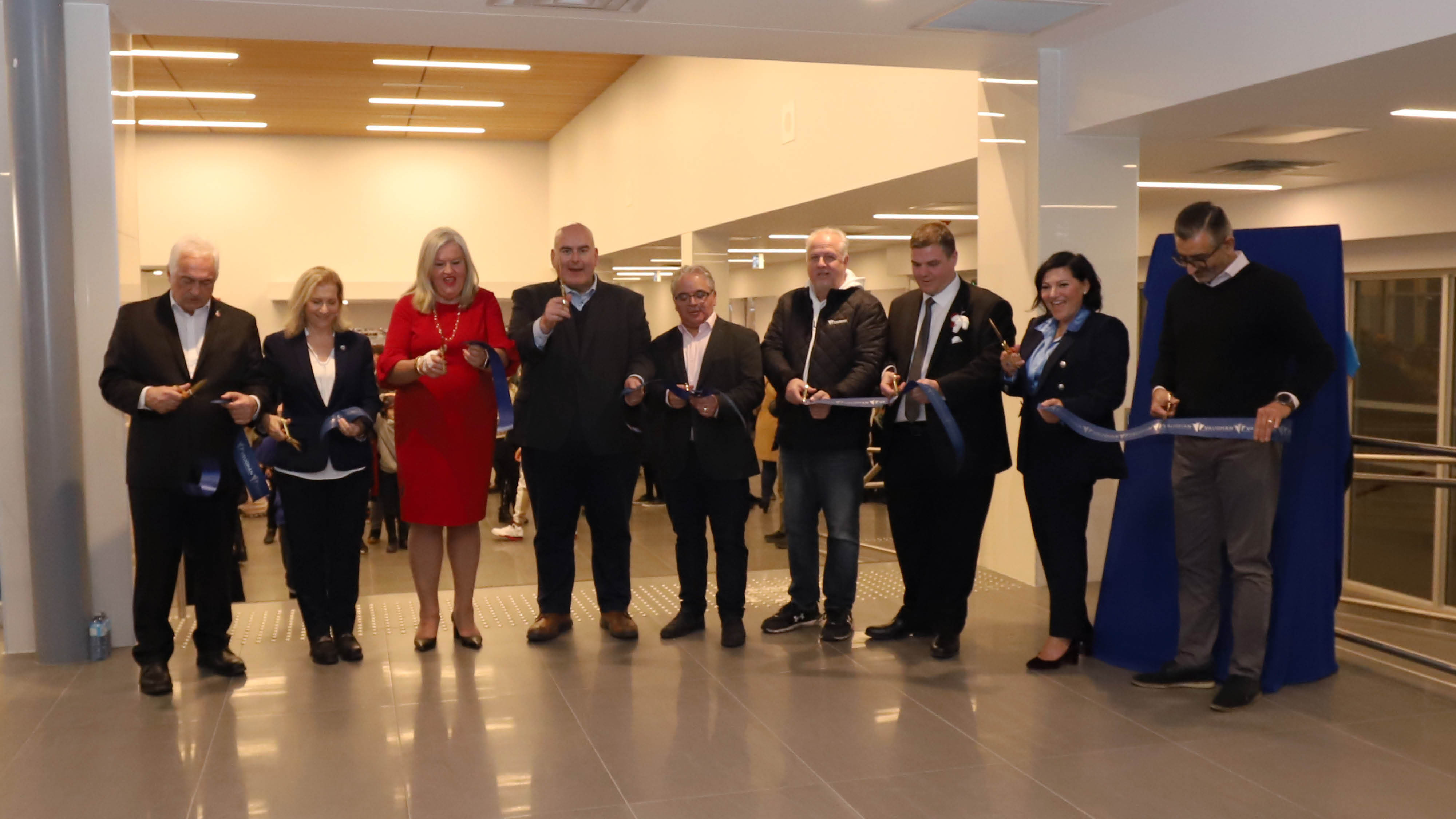 Delegates cut a ribbon to celebrate the grand re-opening of the Garnet A. Williams Community Centre.