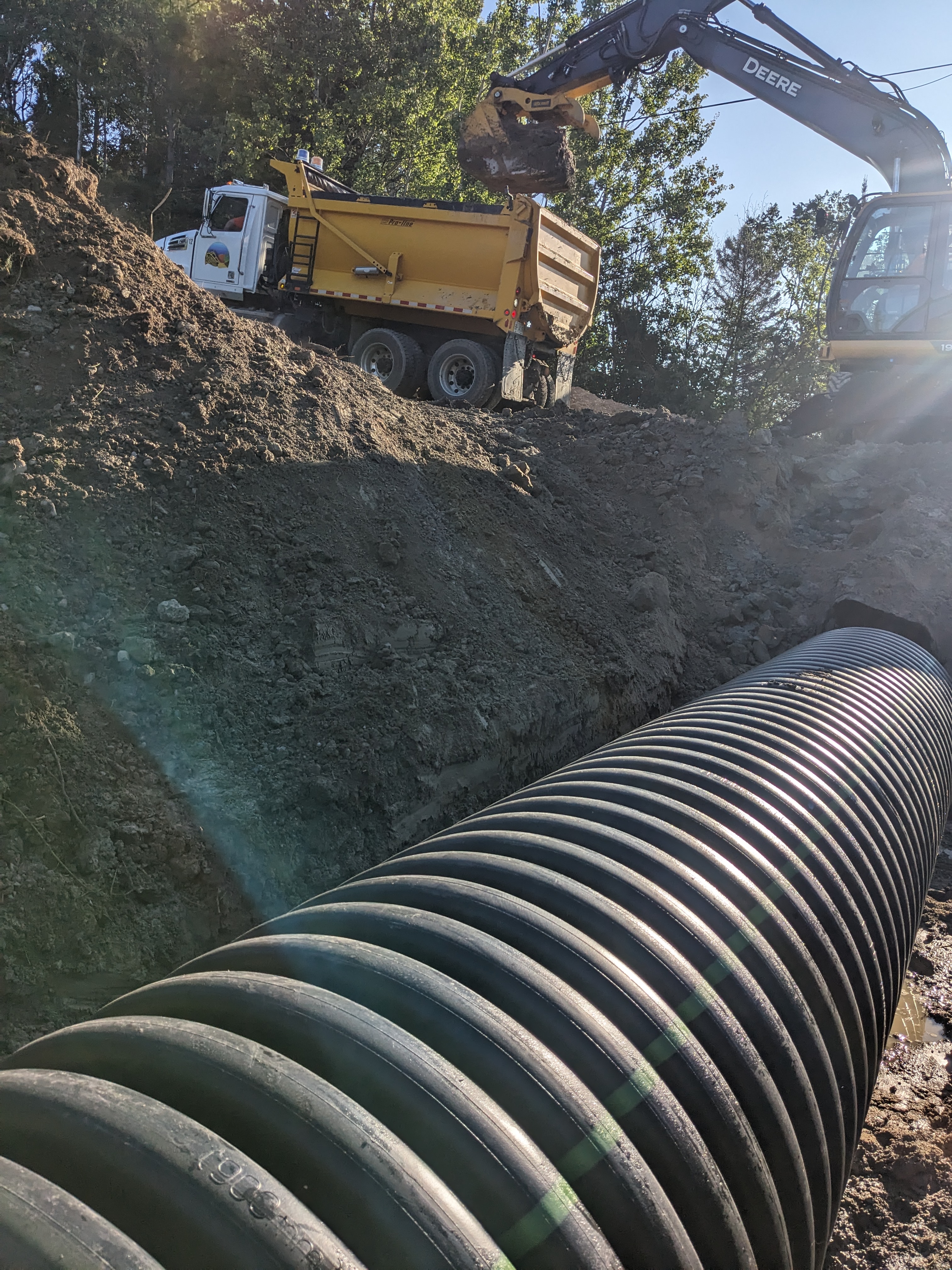 Workers replacing a culvert in Plummer Additional. 