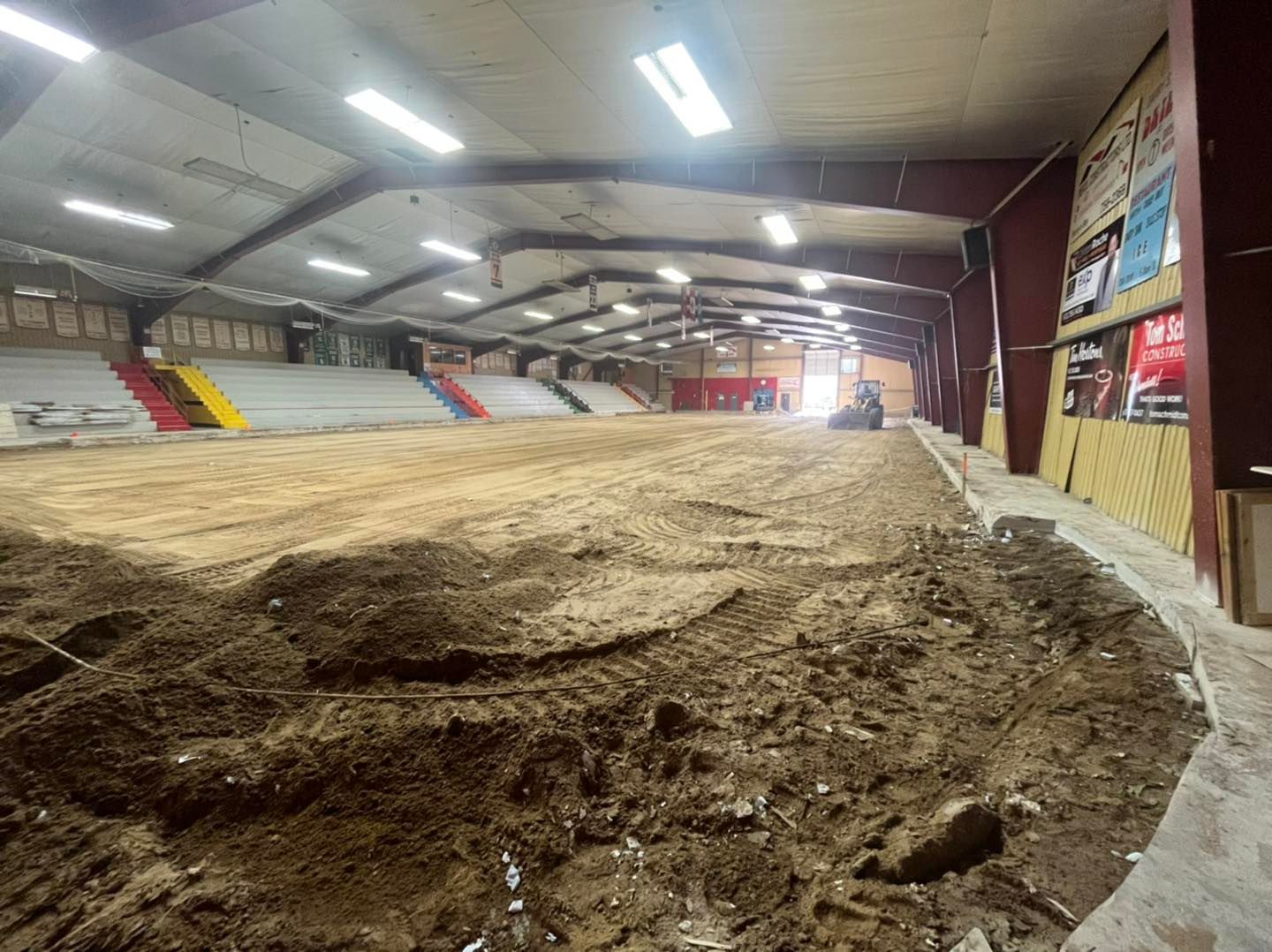 Work being done on the inside of an arena structure.