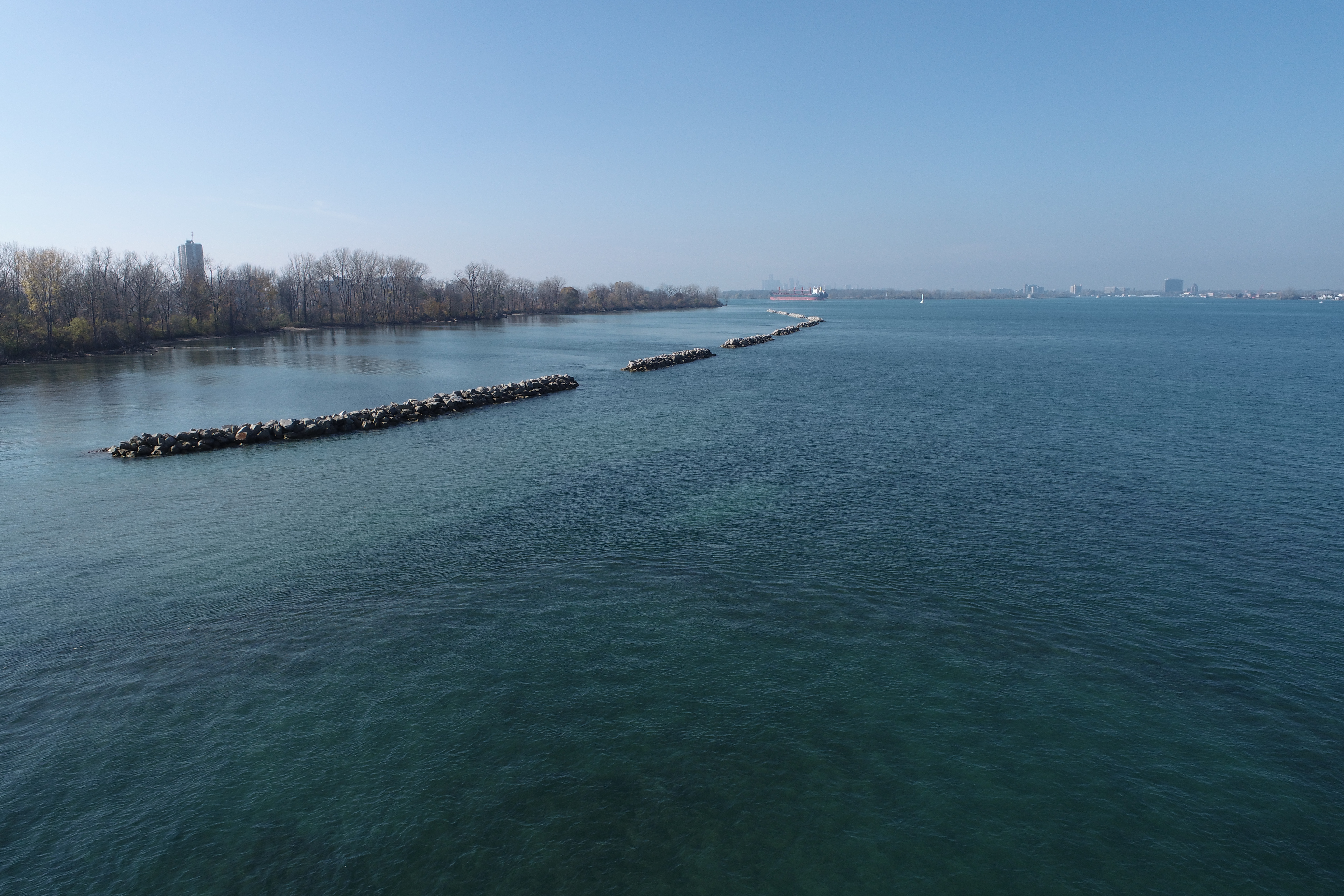 a shoreline with rock berms
