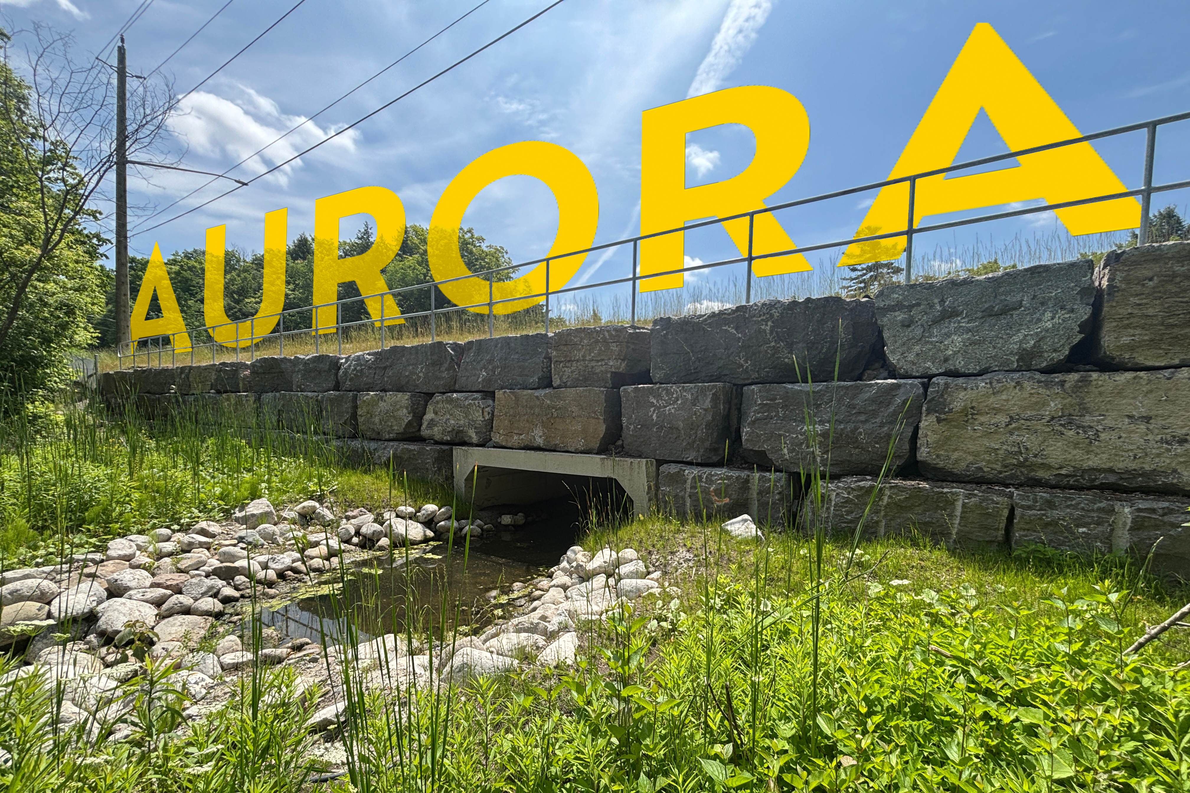 A culvert with the word Aurora overlayed
