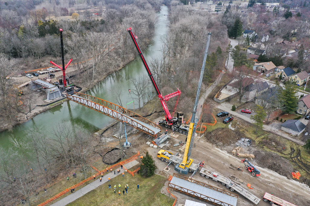 Overhead view of construction equipment building a bridge