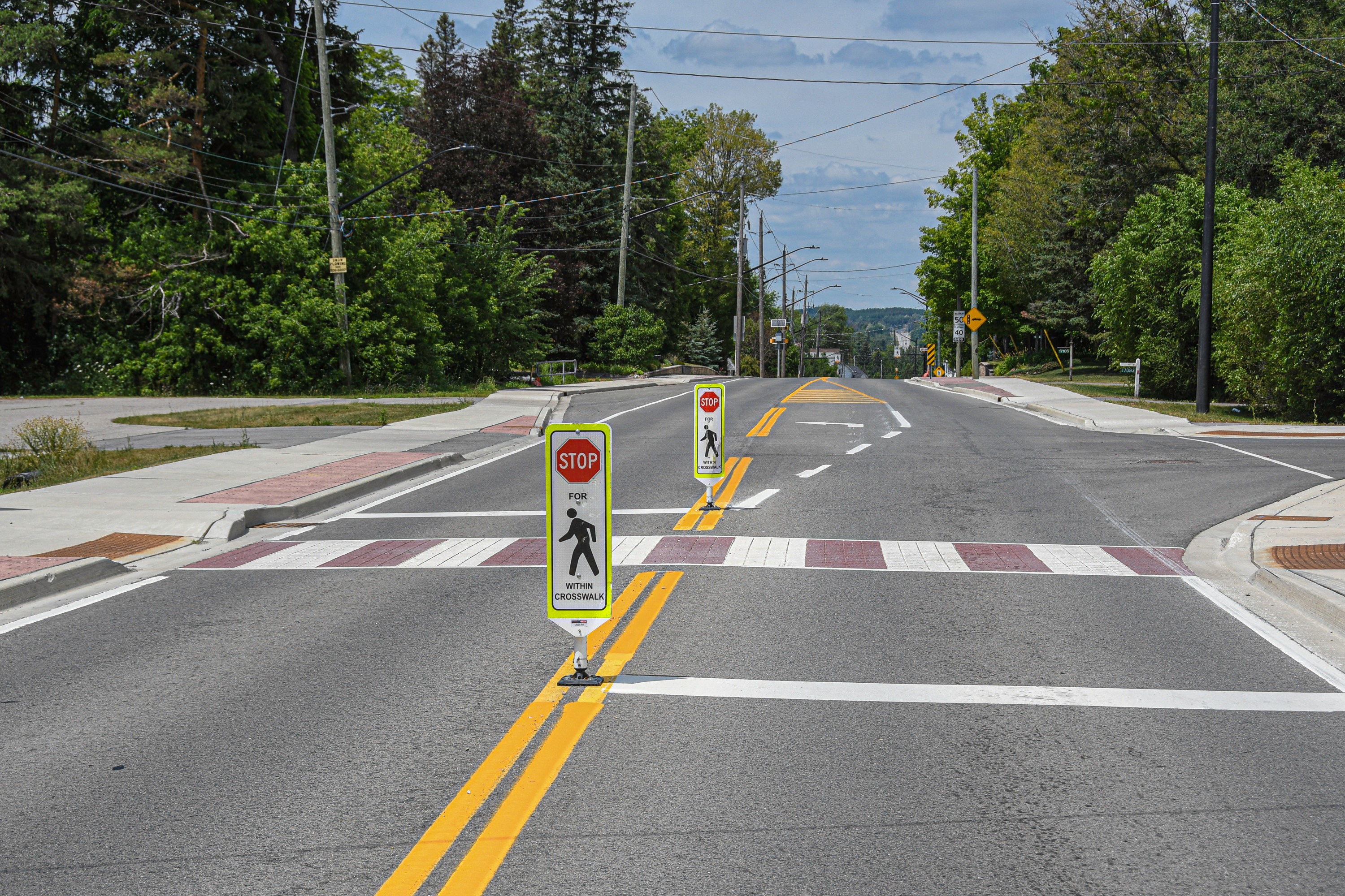 A road with a new pedestrian crosswalk