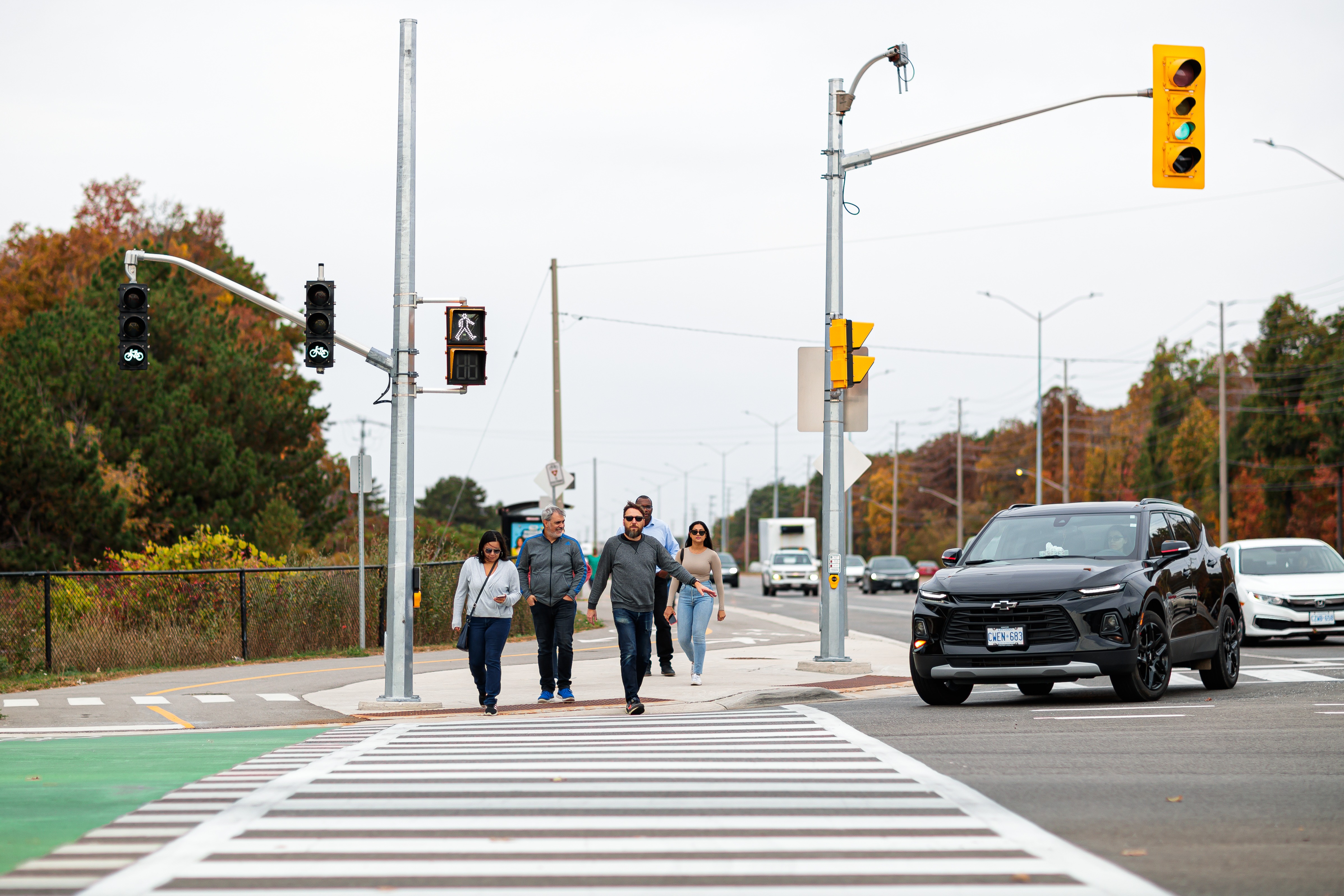 People walking across a crosswalk