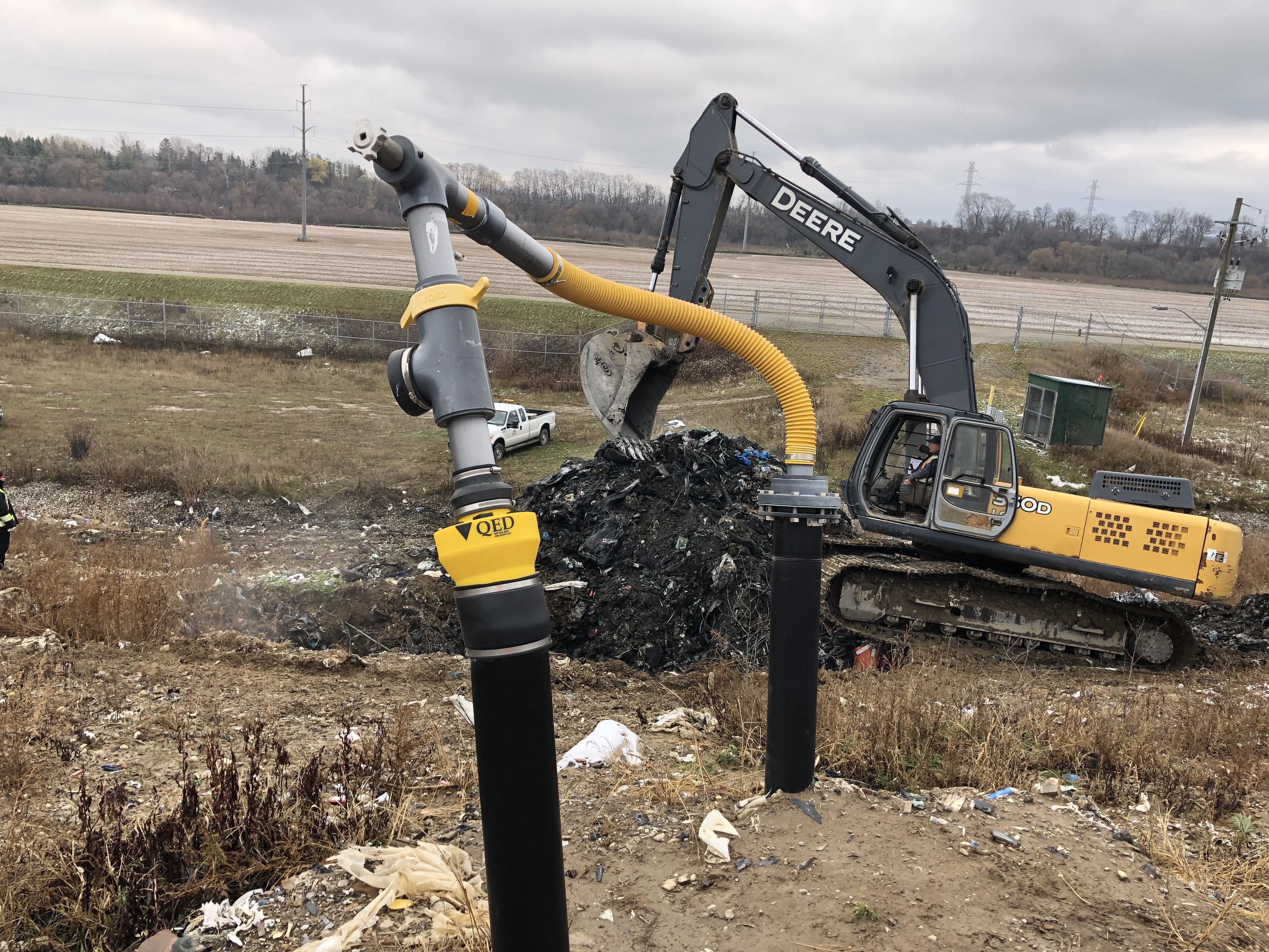 A man works in a backhoe at the Brantford landfill site. 
