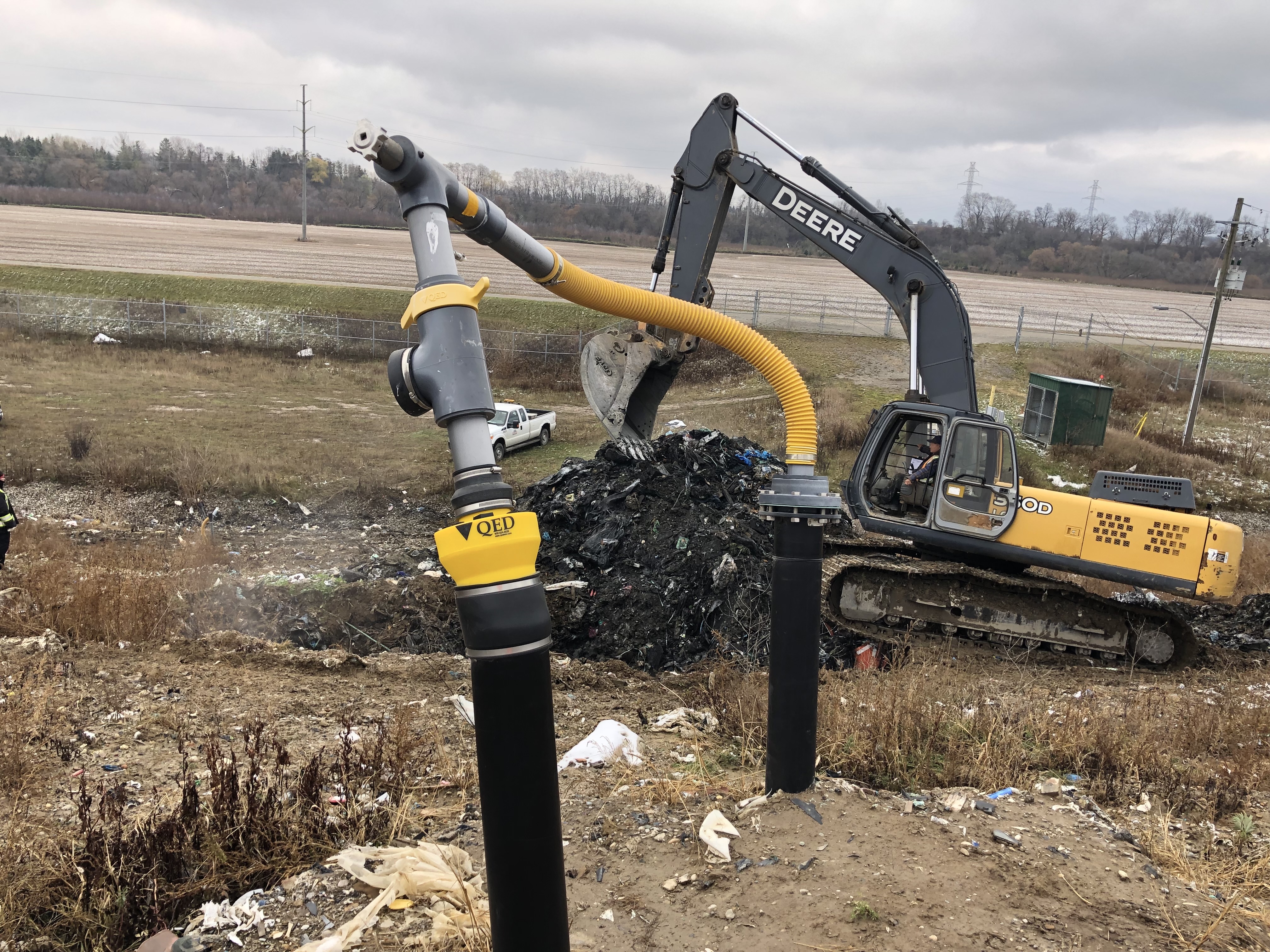 A man works in a backhoe at the Brantford landfill site.