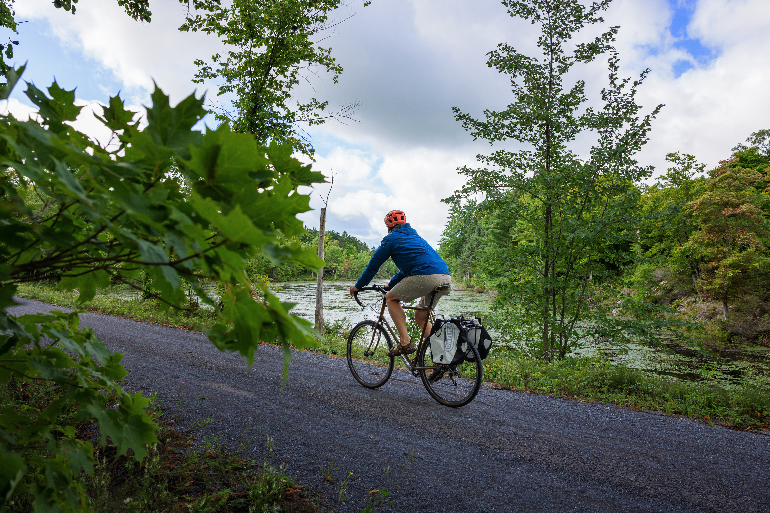 a person biking on a trail