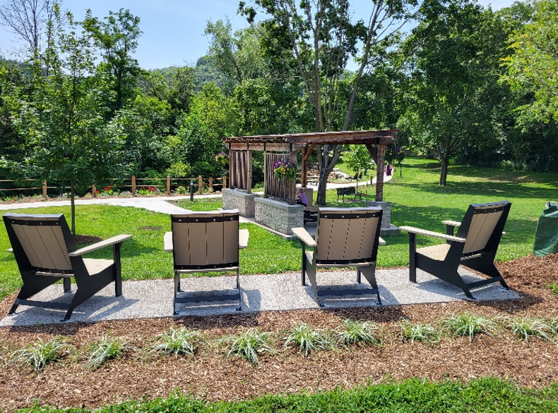 Wooden chairs looking over a park