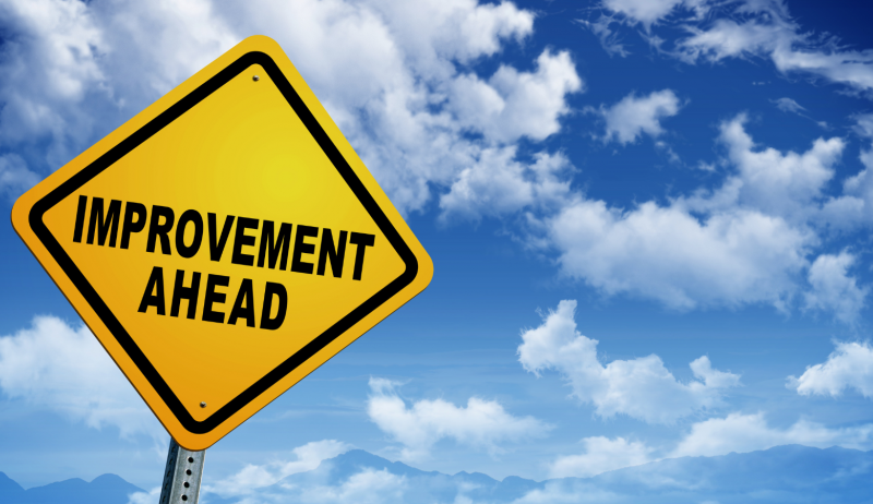 A stock image of a sign reading "improvement ahead". 