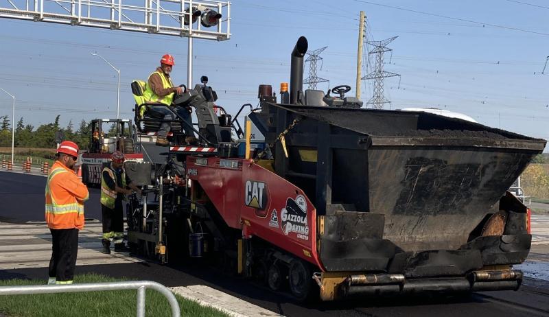 a construction crew paving a road
