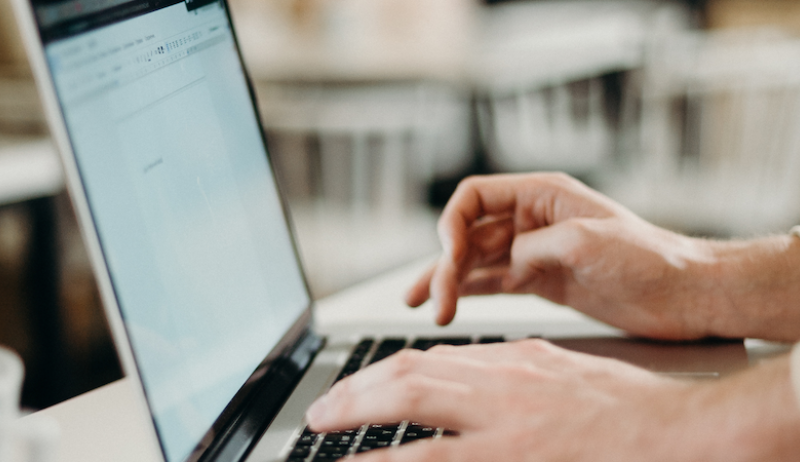 A stock image of a person using a laptop. 