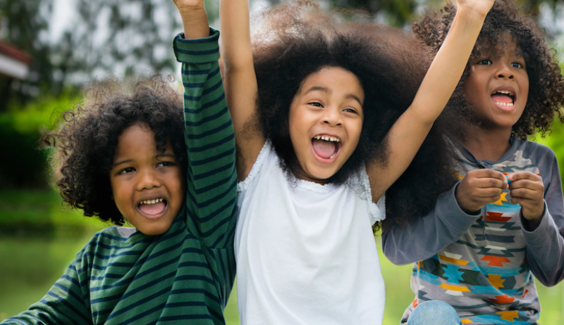 A stock image of three children. 