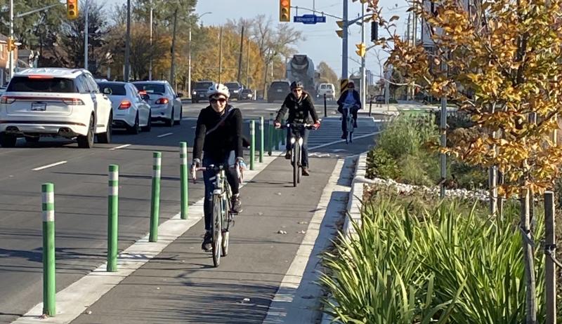 Two cyclists use Burlington's new dedicated cyclist lanes. 