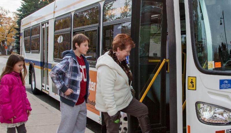 People board a transit bus in the City of Burlington. 