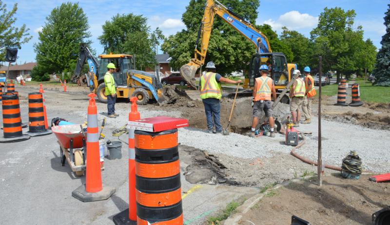 Construction workers on site during a road reconstruction project. 