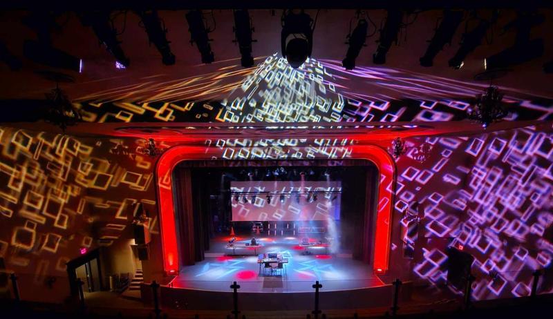 An auditorium with colourful lights