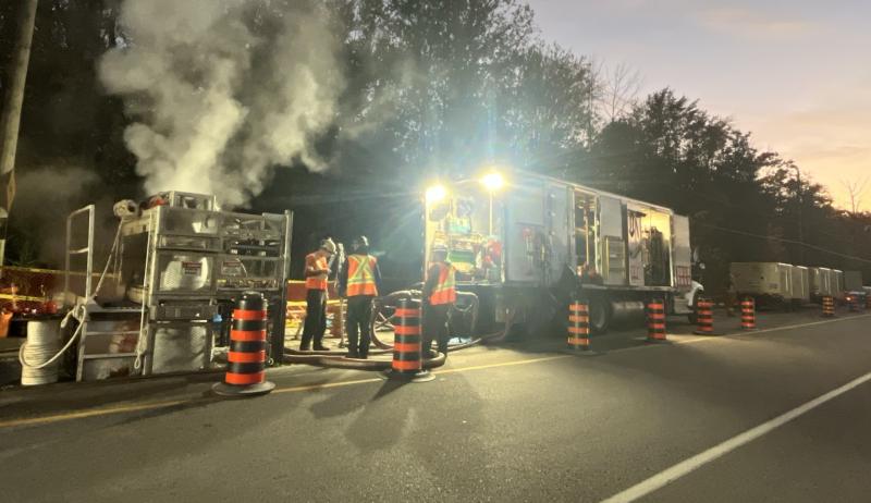 Construction crew installing sewer