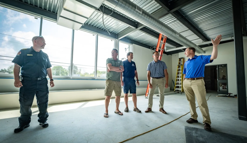 a small group touring a facility