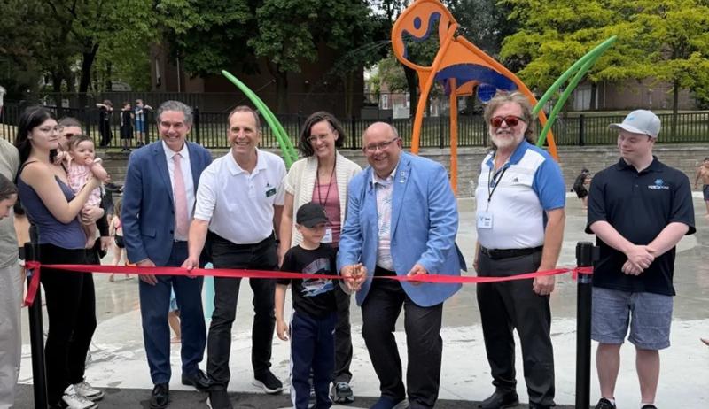 several representatives at a ribbon cutting event for the community centre