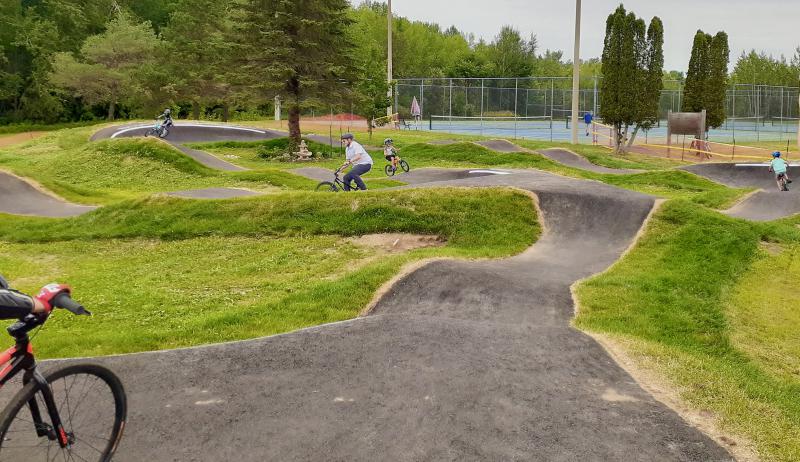 A photograph of cyclists using the Perth Pump Track.