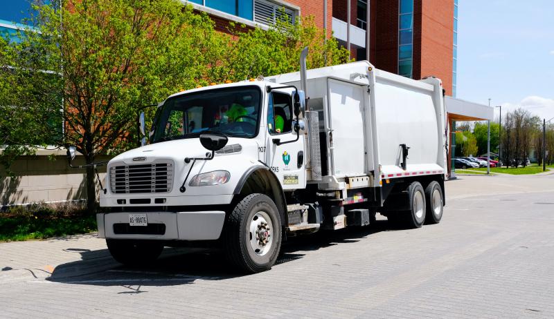 A photograph of a recycling truck in the City of Woodstock, Ontario.